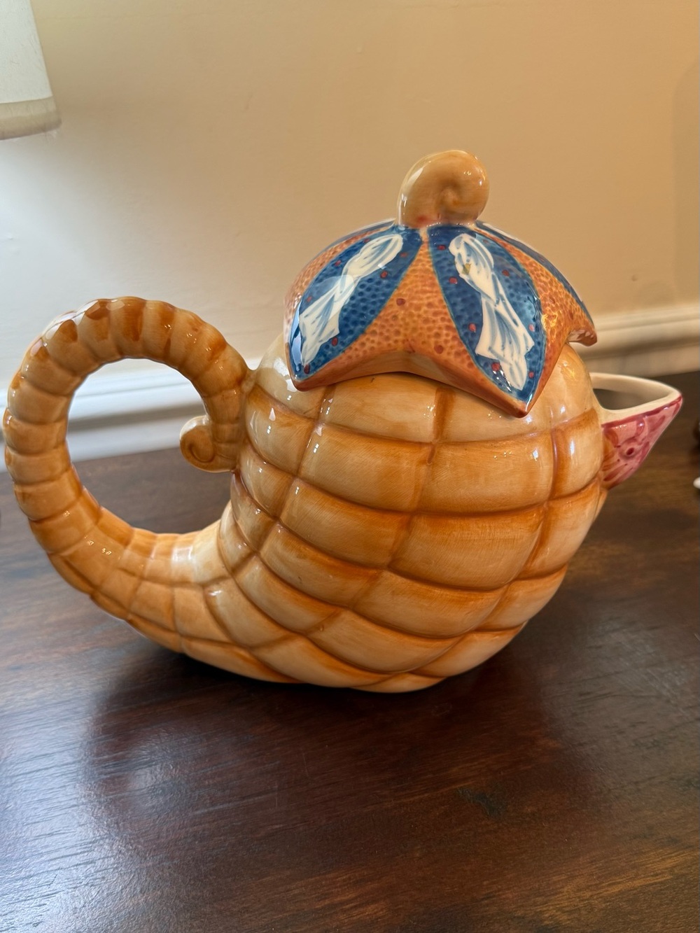 Handcrafted Shell-Shaped Ceramic Teapot in Orange with Blue Accents